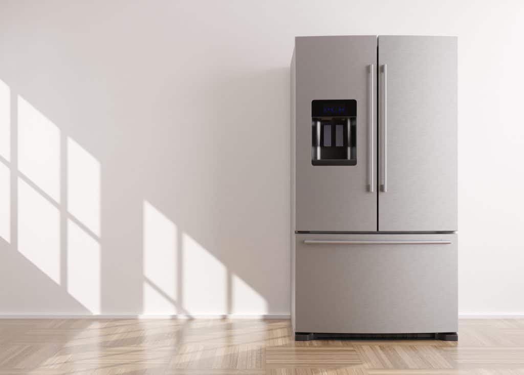 Refrigerator standing in empty room